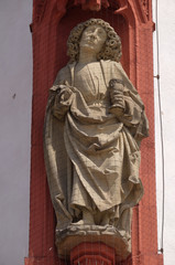 Fototapeta na wymiar Saint John the Apostle statue on the portal of the Marienkapelle in Wurzburg, Bavaria, Germany