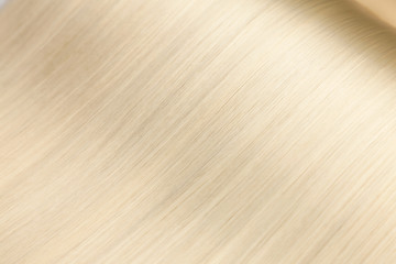 Closeup on luxurious glossy blonde hair