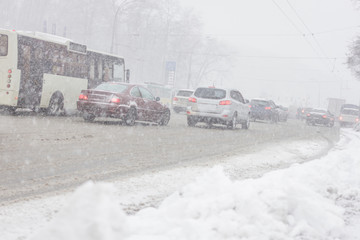 Traffic jam in snowstorm, Kiev. Winter snow road with cars