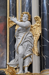 Obraz premium Angel statue on the Provost’s altar in Wurzburg Cathedral dedicated to Saint Kilian, Bavaria, Germany
