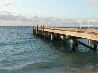 A Wooden Jetty at Jurian Bay in Western Australia during sunset