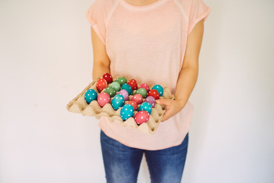 woman hold easter eggs
