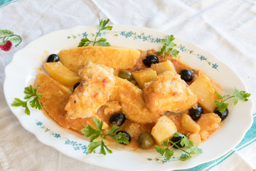 Cod with tomatoes and polenta