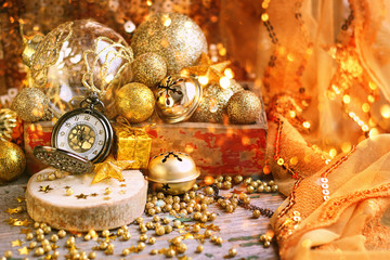 Christmas composition with decorations for Christmas trees and vintage watches. festive background. Waiting for holiday. Soft focus.