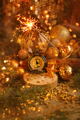 retro watches, new year concept. New year still life with decorations for the Christmas tree and  grandfather clock. The expectation of the holiday. Soft focus.