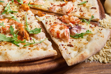 Delicious italian pizza served on wooden table