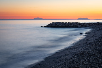 Sunset on the beach with Gibraltar in the background