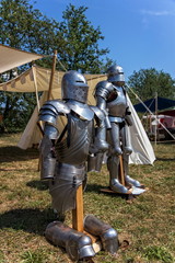 medieval armor in front of a tent