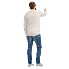 A man in jeans sweater showing on a white background isolation back view