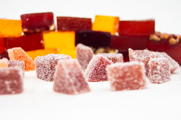 colorful fruit jelly candy on white backdrop