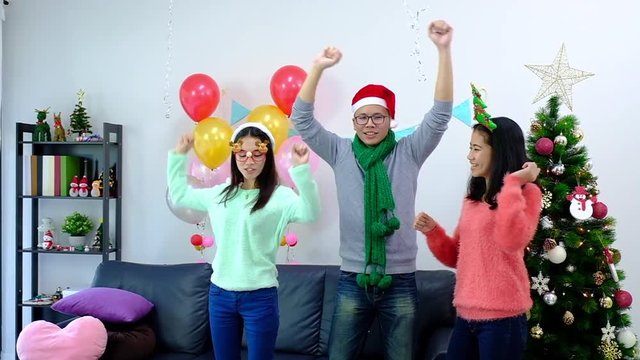 icture showing group of friends celebrating Christmas at home. surprised friend happy in office