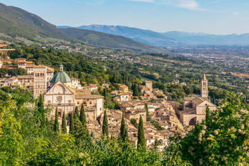 Fototapeta na wymiar Panoramic view of the historic town of Assisi and Famous Papal Basilica of St. Francis of Assisi (Basilica Papale di San Francesco) Umbria, Italy