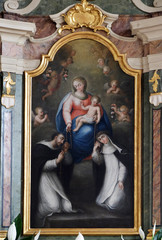 Fototapeta na wymiar Our Lady of Holy Rosary, altarpiece in the Saint George church in Luson, Italy