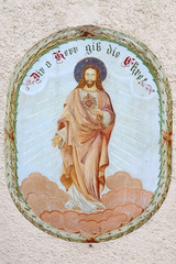 Sacred Heart of Jesus, fresco on the facade of Saint George church in Luson, Italy