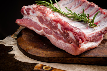 fresh meat on a wooden board. Steak, ribs polar bear, heel