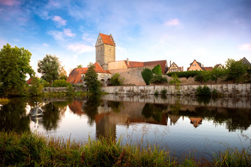 Historic old town of Dinkelsbuhl, reflecting in the river. landmark at the romantic road middle Franconia, Germany