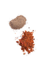 ground red and black pepper on white background