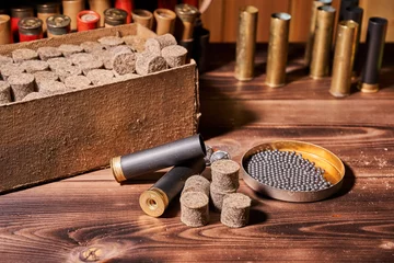 Zelfklevend Fotobehang Hunting equipment for making cartridges on a wooden table © Vitalii Makarov