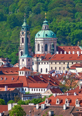 Fototapeta na wymiar Czech Republic Prague - St. Nicolas Church and Rooftops of Lesse