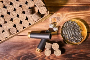 Zelfklevend Fotobehang Hunting equipment for making cartridges on a wooden table © Vitalii Makarov