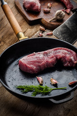 fresh meat on a wooden board. Steak, ribs polar bear, heel