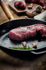 fresh meat on a wooden board. Steak, ribs polar bear, heel