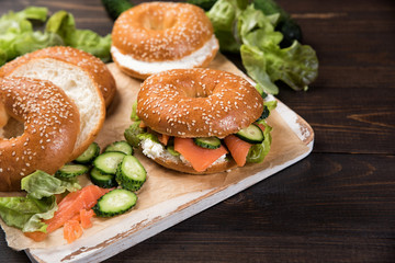 Fresh homemade bagel sandwiches with smoked salmon