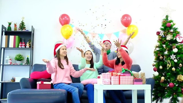 icture showing group of friends celebrating Christmas at home. surprised friend happy in office