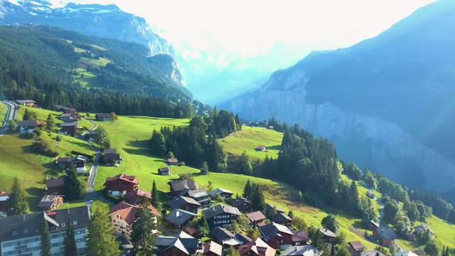 Beautiful Mountain Chalets in the Alps, Wengen. Aerial view on clear day. Bern, Switzerland.