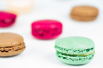 colorful macaroons on white background