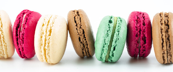 colorful macaroons on white background