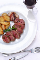Roast beef and potatoes on a plate