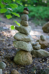 Stone man landart, sandstone stones high tower, harmony and balance, stone man on the path