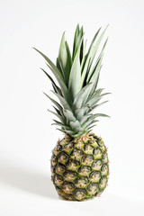 Fototapeta premium Pineapple on a white background. Close-up. Vertical frame orientation.