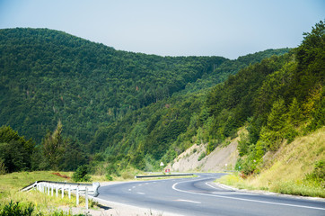 The road to the mountains. Mountain landscape on a summer day.