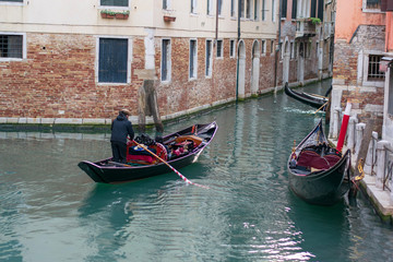 Fototapeta na wymiar gondolas on a water channel in venice