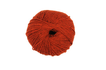 A skein of wool of red color for knitting. View from above.