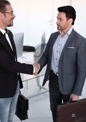 Fototapeta premium welcoming handshake of a businessman with a lawyer