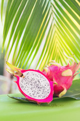 Fresh, tasty tropic, exotic dragon pitahya dragon fruit near palms