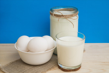 milk and eggs on a blue background, a farmer's natural foods