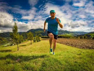Male athlete running in mountains