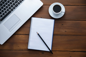 notepad and keyboard with coffee