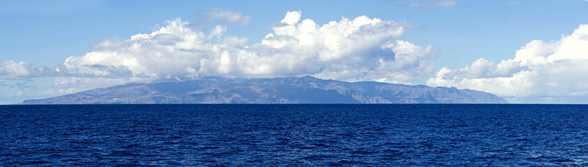 Obraz na płótnie Canvas Tenerife Island in the clouds from the open ocean