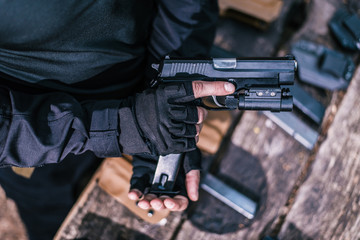 sports shooting instructor check your weapons close-up
