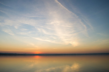 Beautiful red sunset over lake. Composition of nature.