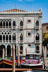 Naklejka premium Facade of Ca D'Oro palace on Grand Canal in Venice, Italy. One of the older palaces in the city, it is known as Ca' d'Oro or golden house
