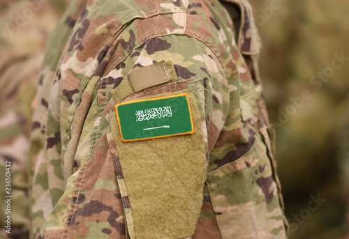 Flag of Saudi Arabia on soldiers arm (collage).