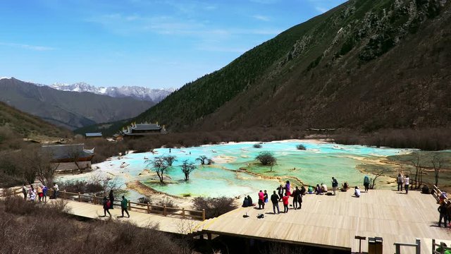 The Yellow Dragon Taoist Temple and travertine landscapes and pools of Huanglong (literally: Yellow Dragon), Sichuan, China. Huanglong was declared a World Heritage Site by UNESCO in 1992.
