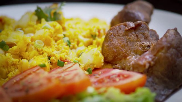 Ecuadorian Fritada with mote pillo and salad