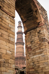 Qutub Minar, 73-meter tall tapering tower of five storeys, started construction by Qutab-Ud-Din-Aibak, founder of the Delhi Sultanate